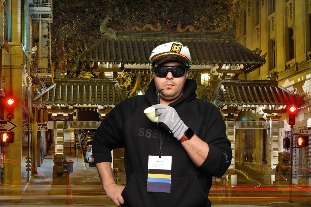 Man poses for a photo in front of a greenscreen San Francisco Photo Booth.