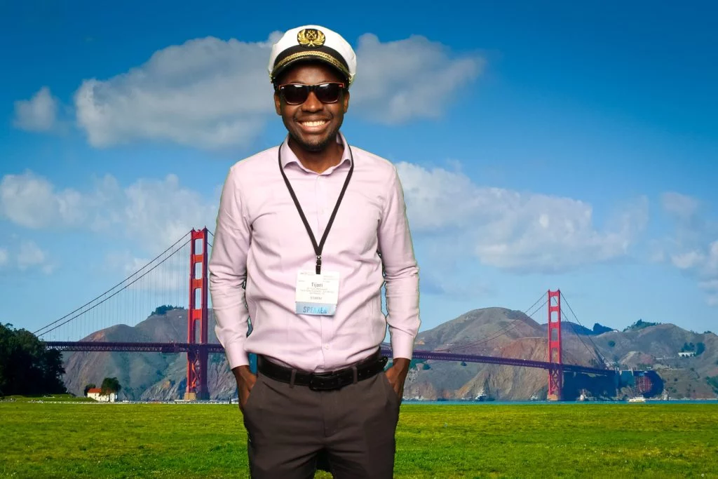 Man poses for a photo in front of a greenscreen San Francisco Photo Booth.