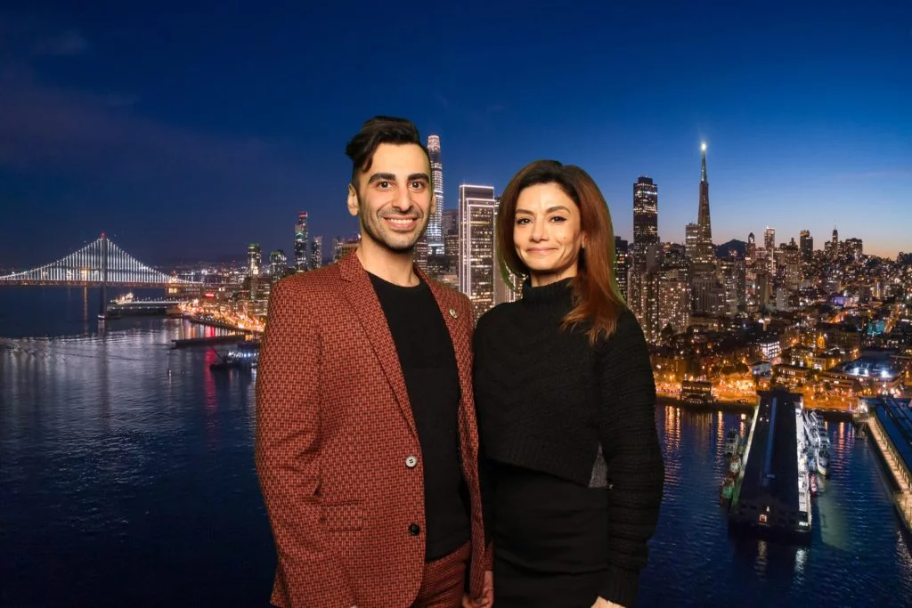 Couple poses for a photo in front of a greenscreen San Francisco Photo Booth.