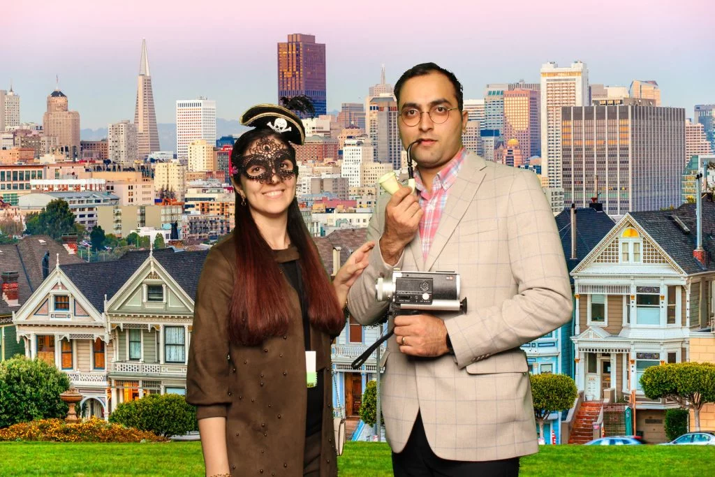 Couple poses for a photo in front of a greenscreen San Francisco Photo Booth.