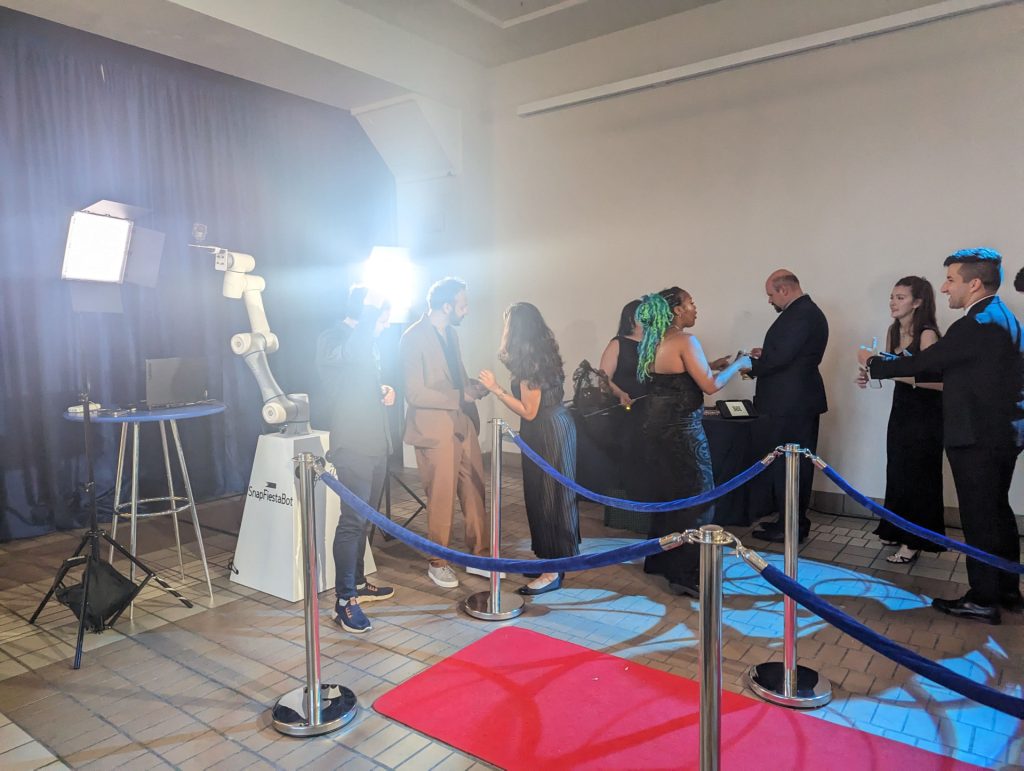 Guests posing for a Glambot video at a glamorous Bay Area event with customized backdrops.