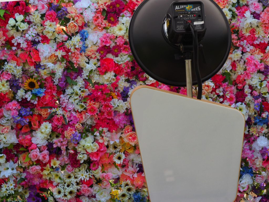 Classic Photo Booth in front of a Floral Wall