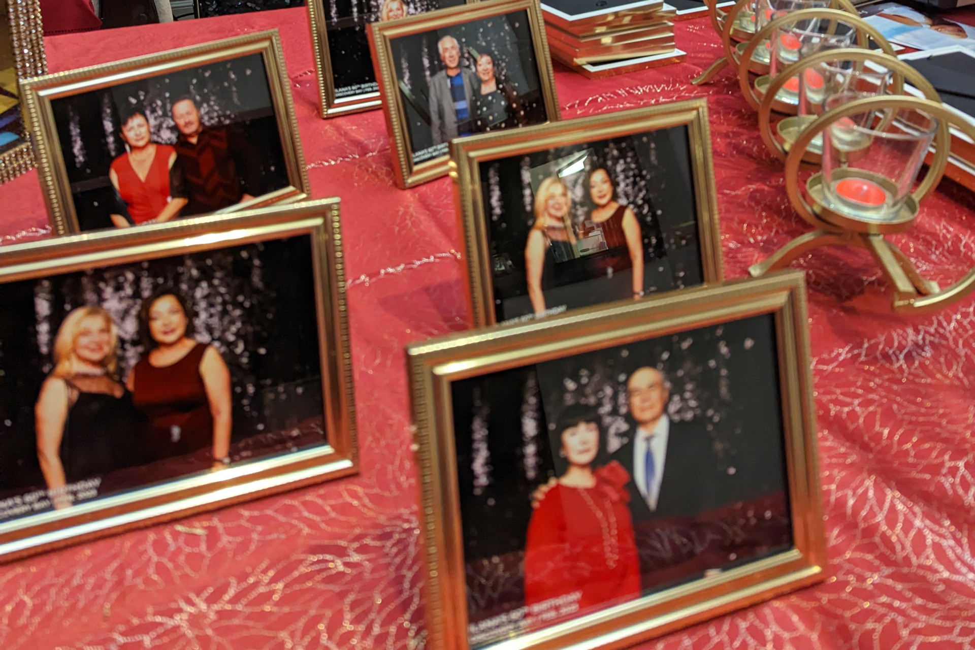 A wedding photo booth that features guests' images being framed as a party favor.