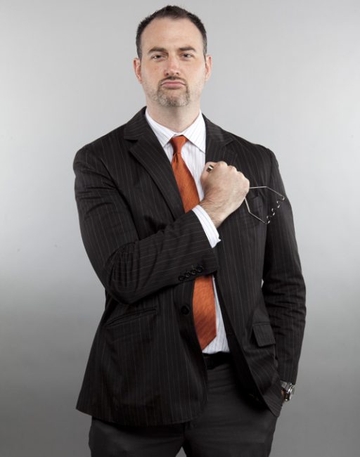 Man with a spatula posing for a headshot