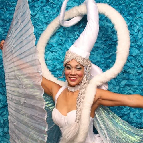 a woman wearing a swan costume in a photobooth rental