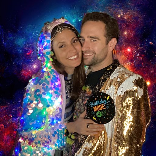 a man and a woman in front of a space background